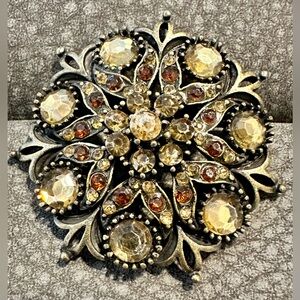 Vintage Ornate Gemstone Brooch with Intricate Design